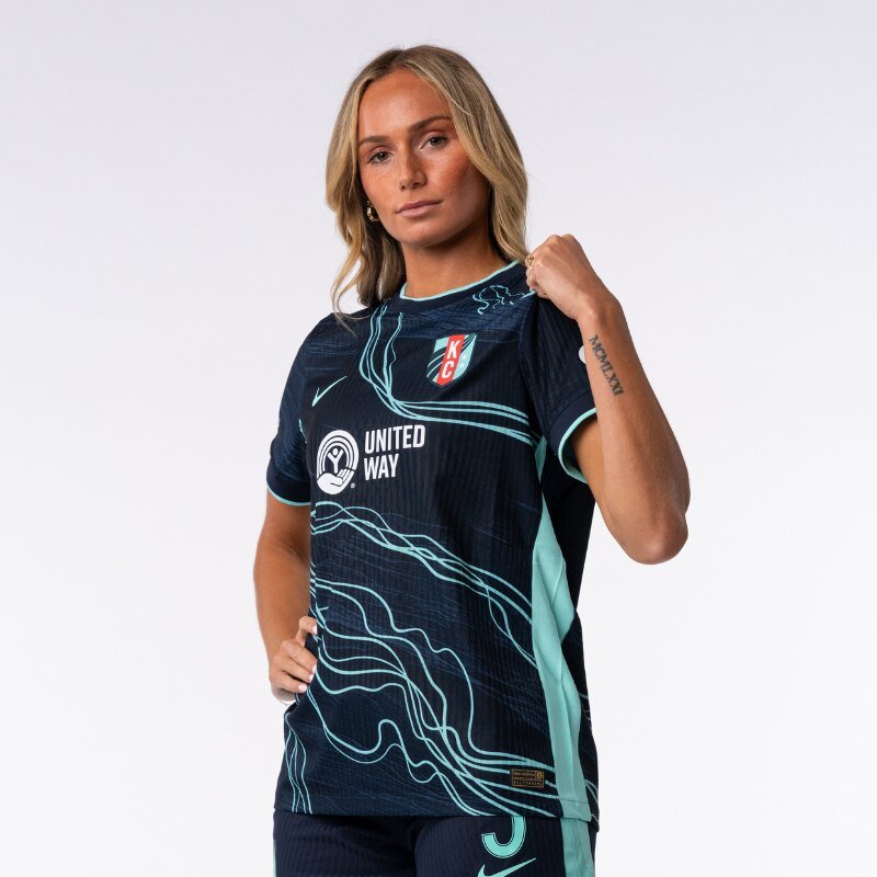 Ellie modeling the Kansas City Current away kit